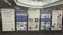 5 free-standing panels with information about The Triangle newspaper on them