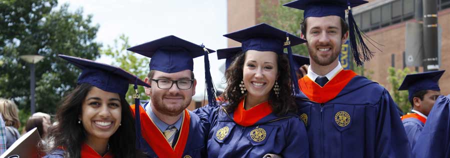 Drexel graduates on graduation day, wearing their graduation regalia.