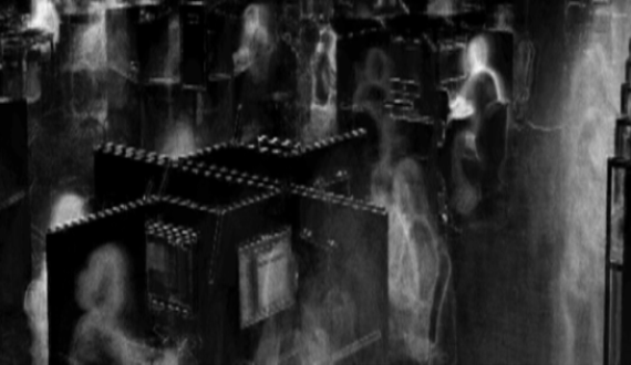 black and white photo of students studying in the library 