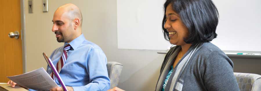 Two members of the Drexel faculty in a classroom.